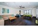 Bright living room with dark wood floors, comfortable seating, and a dining area with backyard views at 3901 Bayshore Ne Blvd, St Petersburg, FL 33703