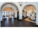 Expansive living space with arched doorways, dark hardwood floors, neutral decor, and plenty of room for entertaining at 3901 Bayshore Ne Blvd, St Petersburg, FL 33703