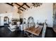 Spacious open-concept living area with a stone fireplace, dark wood floors, and a dining table at 3901 Bayshore Ne Blvd, St Petersburg, FL 33703