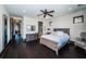 Comfortable bedroom featuring neutral tones, dark wood floors, and a dresser with a mirror at 3901 Bayshore Ne Blvd, St Petersburg, FL 33703