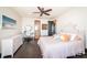 Bright main bedroom with a ceiling fan, a desk, and ensuite bathroom access at 3901 Bayshore Ne Blvd, St Petersburg, FL 33703
