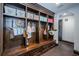 Custom mudroom with dark wood lockers, drawers, and bench space at 3901 Bayshore Ne Blvd, St Petersburg, FL 33703
