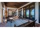 Covered outdoor patio with lounge chairs, tile flooring, and view of the water at 3901 Bayshore Ne Blvd, St Petersburg, FL 33703