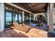 Spacious outdoor patio with tile flooring, lounge chairs, and view of the waterfront at 3901 Bayshore Ne Blvd, St Petersburg, FL 33703