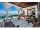Relaxing outdoor patio featuring lounge chairs, tile flooring, and stunning water views at 3901 Bayshore Ne Blvd, St Petersburg, FL 33703