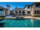 Beautiful pool area with spa, elegant stone accents, covered patio, and inviting outdoor space at 3901 Bayshore Ne Blvd, St Petersburg, FL 33703