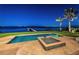 Beautiful in-ground pool with ocean views and a private dock surrounded by lush tropical landscaping, perfect for relaxation at 3901 Bayshore Ne Blvd, St Petersburg, FL 33703