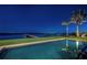 Enjoy the night with serene pool view overlooking the ocean and a private dock, perfect for peaceful evenings at 3901 Bayshore Ne Blvd, St Petersburg, FL 33703