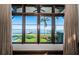 Stunning water view from a window with views of tropical landscaping and a private dock at 3901 Bayshore Ne Blvd, St Petersburg, FL 33703