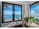 Picturesque windows overlooking the waterfront, a private dock, and tropical greenery at 3901 Bayshore Ne Blvd, St Petersburg, FL 33703