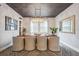 Sophisticated dining room with stylish lighting fixture, neutral color palette, and elegant decor at 4224 W Kensington Ave, Tampa, FL 33629
