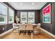 Elegant dining room with modern furnishings, stylish wall coverings, and ample natural light at 4224 W Kensington Ave, Tampa, FL 33629