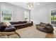 Comfortable living room with sectional sofa, beanbag chair, and bright windows at 4224 W Kensington Ave, Tampa, FL 33629