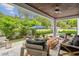 Beautiful outdoor patio area with comfortable seating and lush landscaping at 4224 W Kensington Ave, Tampa, FL 33629