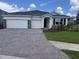 Charming single-story home featuring a brick-paved driveway and a two-car garage at 4327 Pullet Ct, Lakewood Ranch, FL 34211