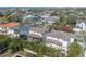 Aerial view of the property showcasing the tile roof, pool, and neighborhood at 5020 W Dickens Ave, Tampa, FL 33629