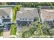 Aerial view of house with a long driveway and three car garage at 5020 W Dickens Ave, Tampa, FL 33629