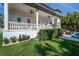 Beautiful outdoor living space with a covered patio overlooking a manicured lawn and tropical foliage at 5020 W Dickens Ave, Tampa, FL 33629
