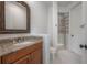 Cozy bathroom featuring granite counters, walk-in shower and updated fixtures at 5020 W Dickens Ave, Tampa, FL 33629