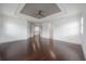 Bright and airy bedroom featuring hardwood floors and an open layout, with views to the hallway at 5020 W Dickens Ave, Tampa, FL 33629