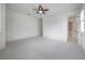 Airy bedroom with ensuite bathroom access and ceiling fan at 5020 W Dickens Ave, Tampa, FL 33629