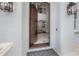 Grand entryway with a solid wood door, detailed sidelights, and an inviting view of the home's interior at 5020 W Dickens Ave, Tampa, FL 33629