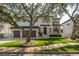 Charming two-story home with a three-car garage and beautifully landscaped front yard at 5020 W Dickens Ave, Tampa, FL 33629