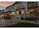 Elegant home exterior with manicured landscaping, stone accents, and a two-car garage at 5020 W Dickens Ave, Tampa, FL 33629