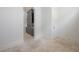 Hallway with travertine tile flooring adjacent to kitchen at 5020 W Dickens Ave, Tampa, FL 33629