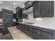 Gourmet kitchen with professional stainless steel appliances, custom cabinetry, and designer finishes at 5020 W Dickens Ave, Tampa, FL 33629