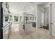 Open concept kitchen featuring a center island, granite counters and stainless steel appliances at 5020 W Dickens Ave, Tampa, FL 33629