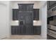 Custom kitchen cabinetry surrounds a full-size refrigerator with built-in water dispenser at 5020 W Dickens Ave, Tampa, FL 33629