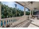 Spacious covered patio with stone columns, offering a beautiful view of the pool and tropical backyard at 5020 W Dickens Ave, Tampa, FL 33629