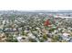 Tampa Bay area home with canal access, mature trees, and a view of the city skyline at 513 Suwanee Cir, Tampa, FL 33606