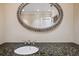 Refined bathroom featuring granite countertops, a stylish mirror, and ample lighting at 513 Suwanee Cir, Tampa, FL 33606