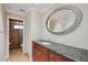 Elegant bathroom showcasing granite countertops and a tiled shower with glass doors at 513 Suwanee Cir, Tampa, FL 33606
