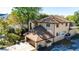 Aerial view showcasing the home's architecture, landscaping, and surrounding greenery at 513 Suwanee Cir, Tampa, FL 33606