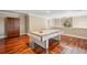 Entertaining game room with a pool table, hardwood floors, and a decorative armoire at 513 Suwanee Cir, Tampa, FL 33606