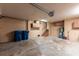 Spacious garage featuring storage cabinets and utility access at 513 Suwanee Cir, Tampa, FL 33606
