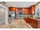 Gourmet kitchen with stainless steel appliances and granite countertops at 513 Suwanee Cir, Tampa, FL 33606