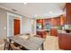 Bright kitchen with stainless steel appliances, granite countertops and dark wood cabinets at 513 Suwanee Cir, Tampa, FL 33606