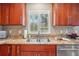 Gourmet kitchen sink with stainless steel appliances and granite countertops at 513 Suwanee Cir, Tampa, FL 33606
