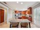 Bright kitchen with stainless steel appliances, granite countertops and dark wood cabinets at 513 Suwanee Cir, Tampa, FL 33606