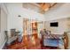 Open concept living area showcasing hardwood floors, high ceilings, and a glimpse into the modern kitchen at 513 Suwanee Cir, Tampa, FL 33606