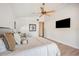 Neutral main bedroom with a ceiling fan and space for seating at 513 Suwanee Cir, Tampa, FL 33606