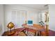 Home office with built-in closet and wood floors at 513 Suwanee Cir, Tampa, FL 33606