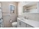 Recently updated bathroom featuring ceramic tiles, a large mirror, and a modern sink vanity at 5130 Dr Martin Luther King Jr St S, St Petersburg, FL 33705
