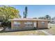 Charming single-story home featuring a well-manicured lawn and cozy front porch at 5130 Dr Martin Luther King Jr St S, St Petersburg, FL 33705