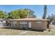 Cozy one-story home exhibiting neat landscaping and a welcoming front facade at 5130 Dr Martin Luther King Jr St S, St Petersburg, FL 33705