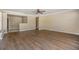 Bright living room boasts beautiful new floors and an open layout to the kitchen at 5130 Dr Martin Luther King Jr St S, St Petersburg, FL 33705